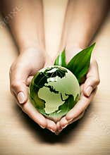 Glass globe in hands