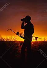 Bowhunter in Sunset