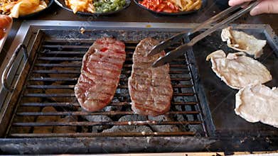 BBQ beef and  pork on grill at restaurant