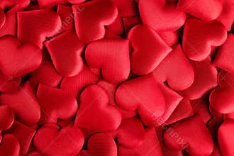 Valentine`s Day Background. Holiday Abstract Valentine Background with red satin Hearts. Heart Shape Backdrop