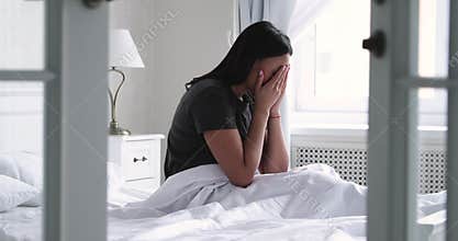 Depressed african woman wake up in bed after bad sleep