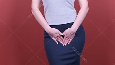 Sick business woman with hands holding pressing her crotch lower abdomen. Medical or gynecological problems, healthcare