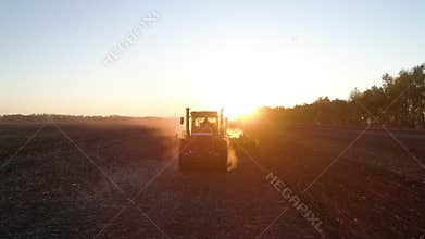 Rural seasonal work, cultivate land on tractor on field of nature farm by farmer