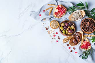 Tu Bishvat holiday symbols - dried fruits, pomegranate, barley, wheat