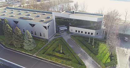 Modern office building with black windows. Exterior of a modern building with black windows, aerial view