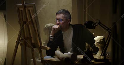 Artist painting on canvas