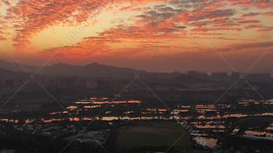 Aerial view of rural green fields in Hong Kong border and skylines in Shenzhen