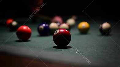 A person playing billiards in billiars club