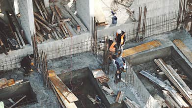 Industrial Building Workers Doing Job Raw Fundament Concrete Cement Using Tools Hard Job Labor Construction In Progress