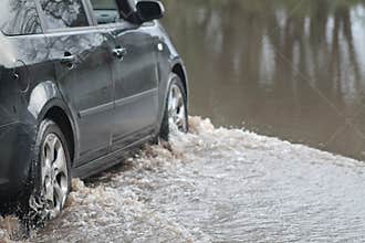 Car Going Through Flood