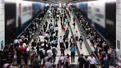 Timelapse of Asian people walk on travelator escalator at Central subway underground station in Hong Kong