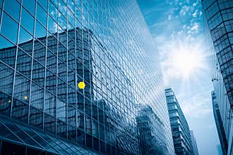 Modern glass building under the blue sky