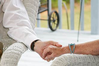 Seniors holding hands