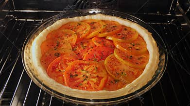 cooking process baked puff pastry pie tart tomato in oven. Time lapse