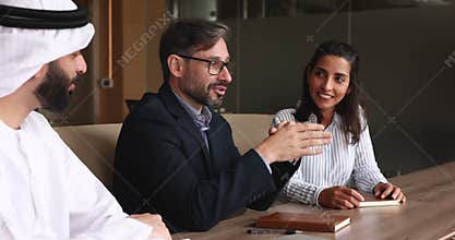 Multicultural business people talking at formal meeting in conference room