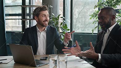 Two diverse business men talking laughing fun at office meeting African and Caucasian businessmen talk multiracial