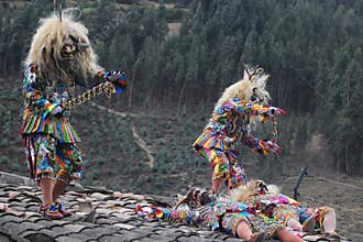 Paucartambo Peru during the procession of the Saqras mischievous devils surround it from the roofs and balconies but they cannot