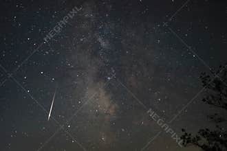 A shooting star at night.