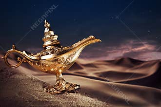 Magic Aladdin's Genie lamp on a desert