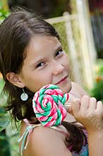 Charming girl and a candy