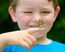 Child holding a butterfly