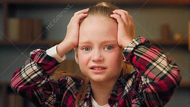 Scared young little girl shocked confused child feeling bullied abandoned alone caucasian blonde female kid preschool