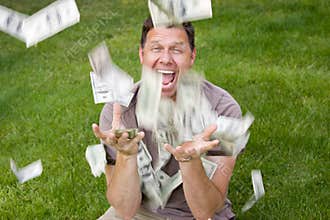 Man catching paper money