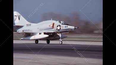Small US navy bombing fighter from the 1960s rolls at high speed