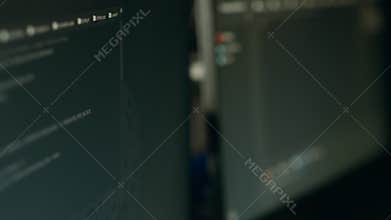 Monitor display of software developer typing database functions script