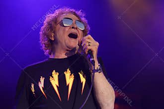 Closeup of Mick Hucknall singing in the live concert of the Simply Red band in Bedford, UK