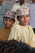 Oman boys with traditional clothing