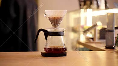 4k video Pour over filter coffee alternative brewing method. Pouring hot water over roasted and ground coffee beans