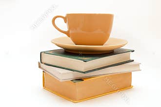 Three books and cup of tea/coffee