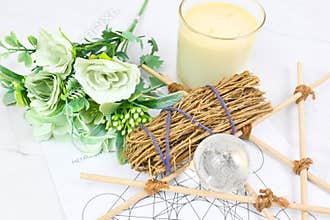Healing crystal spheres clear quartz and white sages herb sticks for clearing negative energy on Metraton cube with pagan star for