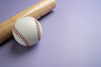 baseball and baseball bat on purple table with copy space background, sport concept
