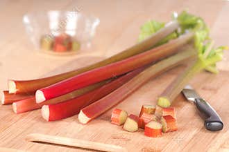 Horizontal of Rhubarb Stalks and Pieces on Wood Counter