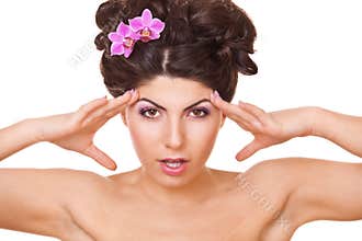 Woman with two flowers orchid in hair