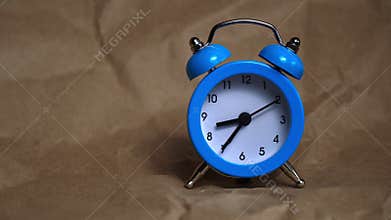 Hands of the Classic Alarm Clock Count the Time