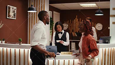 Guests leaving hotel after nice stay