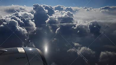 Breathtaking view from plane's illuminator during morning flight. 4K video