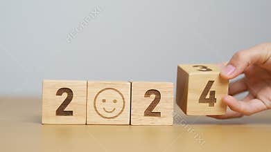 Smile face with 2024 block. Satisfaction, feedback, Review, mental health, eco sustainable and Happy New Year concept