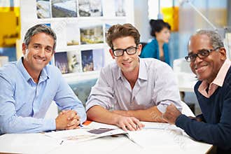 Group Of Men Meeting In Creative Office