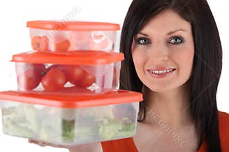 Woman holding plastic storage