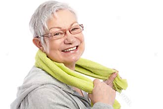Energetic old woman smiling after workout