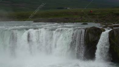 River water falls over cliff of rocks