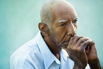Portrait of sad bald senior man
