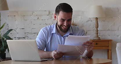 Focused freelance business man reading paper document