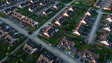 Aerial view of European suburban neighborhood at sunset