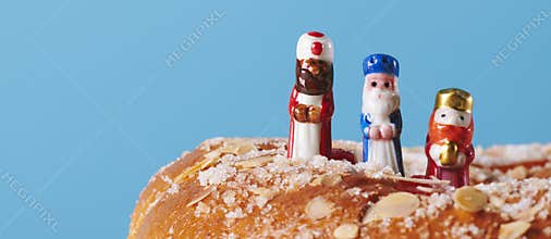 The wise men on top of a king cake, banner format