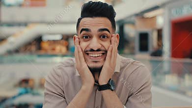 Indian Hispanic ethnic emotional man win face reaction shocked with business achieve achievement amaze guy male